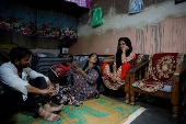 Muskan,16, smiles as she talks to her parents Tofik and Nasreen at their residence in Loni town in the northern state of Uttar Pradesh