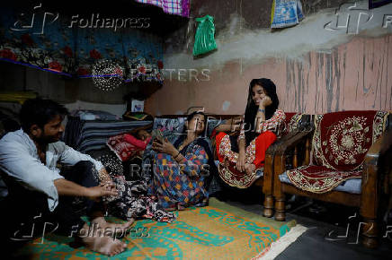 Muskan,16, smiles as she talks to her parents Tofik and Nasreen at their residence in Loni town in the northern state of Uttar Pradesh