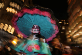 A woman in costume poses for a photo during the annual NYC Halloween Parade in Manhattan in New York