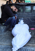 Funeral of Palestinians killed in Israeli strikes at Al-Aqsa Martyrs Hospital in Deir Al-Balah in the central Gaza Strip