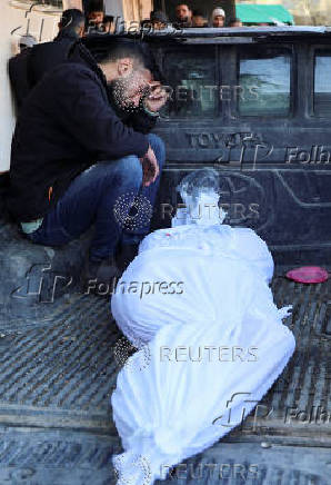 Funeral of Palestinians killed in Israeli strikes at Al-Aqsa Martyrs Hospital in Deir Al-Balah in the central Gaza Strip