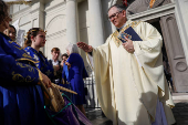 Members of the Perfect Gentlemen Social and Pleasure Club lead a second line parade in New Orleans