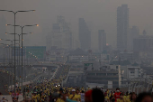 People attend a running event on the newly constructed cable-stayed Rama X Bridge or 