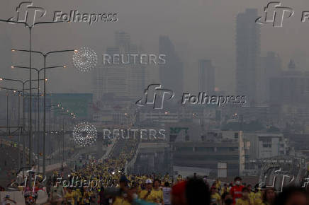 People attend a running event on the newly constructed cable-stayed Rama X Bridge or 