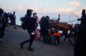 Displaced Palestinians wait to be allowed to return to their homes in northern Gaza, in the central Gaza Strip