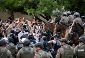 Pro-Palestinian protesters clash with law enforcements officers at the University of Texas