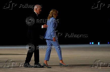 U.S. President Joe Biden and First Lady Jill Biden walk to board an airplane to depart Dobbins Air Reserve Base in Marietta