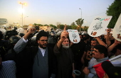 Supporters of Hezbollah Brigades protest against the killing of Nasrallah, in central Baghdad