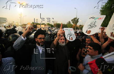 Supporters of Hezbollah Brigades protest against the killing of Nasrallah, in central Baghdad