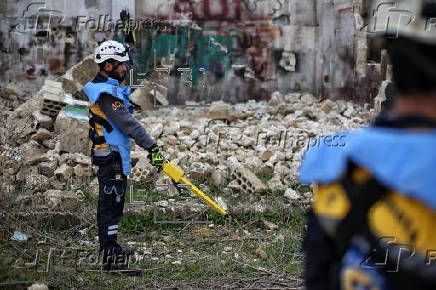 Syrian Civil Defense team clears unexploded ordnance in Idlib countryside