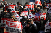 Pro-Yoon protesters participate in a rally outside a court, in Seoul