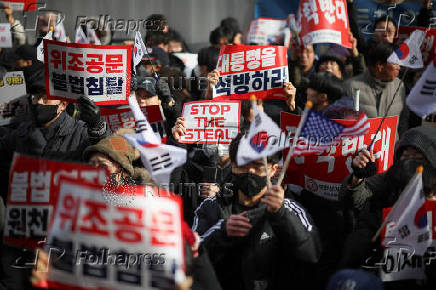 Pro-Yoon protesters participate in a rally outside a court, in Seoul