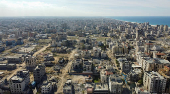 A drone view shows damaged and destroyed buildings, following a ceasefire between Israel and Hamas, in Gaza City