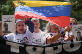 Relatives of detained Venezuelans protest, outside the public prosecutor's headquarters, in Caracas