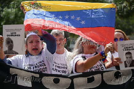 Relatives of detained Venezuelans protest, outside the public prosecutor's headquarters, in Caracas