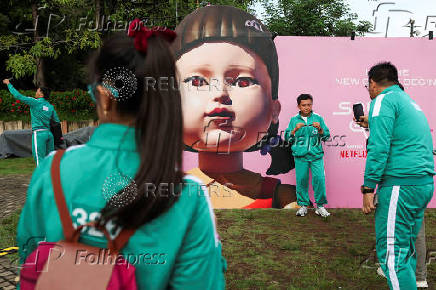 Players attend an event with the Red Light, Green Light game at Gelora Bung Karno Stadium ahead of the release of the Netflix series Squid Game: Season 2 in Jakarta