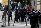 French police cordoned off Iranian consulate in Paris where a man is threatening to blow himself up