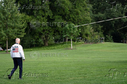 U.S. President Joe Biden wears the team USA Olympics jacket as he departs from the South Lawn of the White House