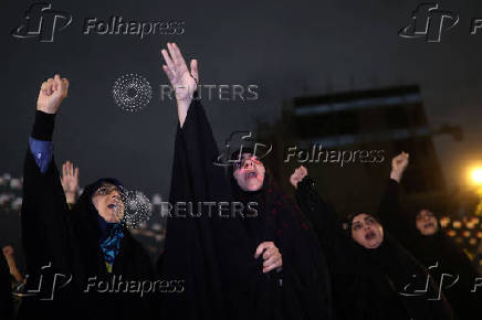 People protest following an Israeli strike on Lebanon, in Tehran