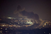 Smoke billows over Beirut's southern suburbs after a strike, amid ongoing hostilities between Hezbollah and Israeli forces