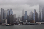 Clouds are pictured over the skyline of New York during a rainy day as it is seen from Weehawken, New Jersey