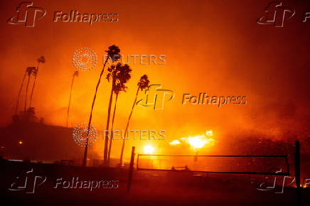 Palisades Fire burns during a windstorm on the west side of Los Angeles