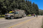 Emergency response forces work after it was reported that people were injured, amid ongoing cross-border hostilities between Hezbollah and Israeli forces, near Arab al-Aramashe