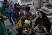 People receive treatment at Al-Najjar Hospital following an Israeli airstrike