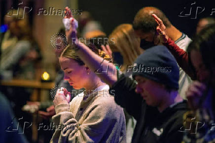 Worshipers at Blackhawk Church gather to pray for victims and survivors of a shooting in Madison