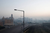 A general view of a business area amid smog and air pollution on a morning in Karachi