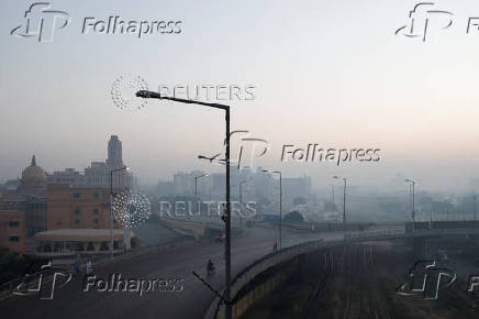 A general view of a business area amid smog and air pollution on a morning in Karachi