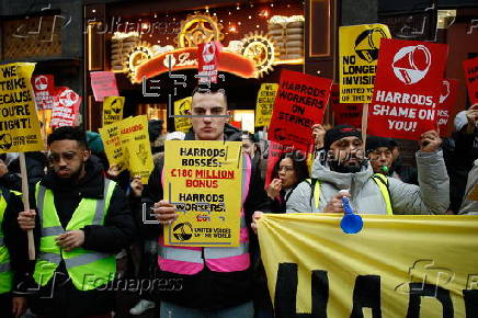 Harrods staff strike for Christmas bonus and better conditions.