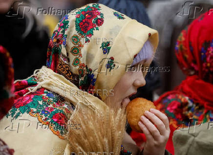 Children dressed in traditional Ukrainian costumes attend a Christmas celebration in Lviv