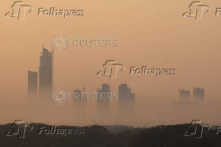 Buildings are seen amid smog and air pollution on a morning in Karachi