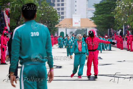 Players take part in the Red Light, Green Light game at Gelora Bung Karno Stadium ahead of the release of the Netflix series Squid Game: Season 2 in Jakarta