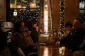 Tourists enjoy last days of gas heaters on Barcelona's terraces