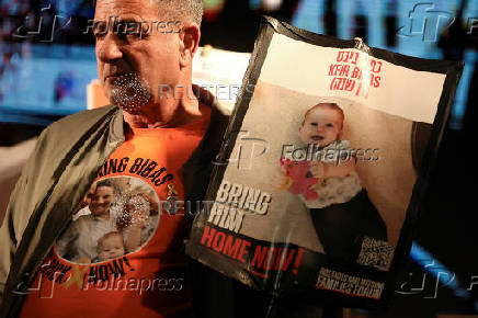 People gather to mark the second birthday of the youngest hostage in Gaza, Kfir Bibas, in Tel Aviv