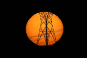 FILE PHOTO: Pylons of high-tension electricity power lines are seen during sunset in Brasilia