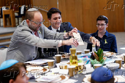 Canada's Prime Minister Trudeau attends a passover meal at the Congregation Agudas Israel Synagogue in Saskatoon