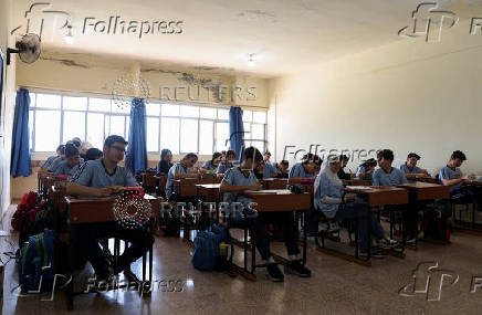 Students attend a class in Al Carmelia School in Mejdlaya