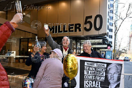 Supporters of Wikileaks founder Julian Assange celebrate outside the U.S. Consulate in Sydney
