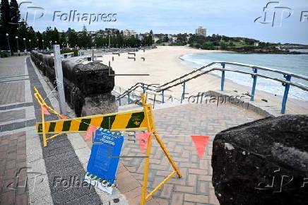 Tar balls washed ashore forces closure of Coogee Beach