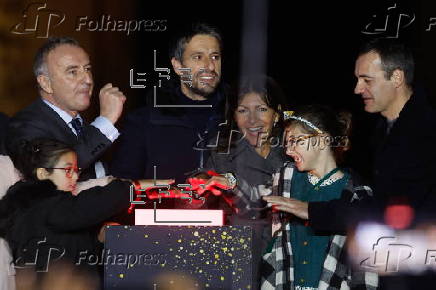 Paris Olympics chief Estanguet turns on Christmas lights on the Champs Elysees