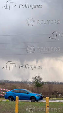 A tornado crosses a field in Katy, Texas