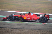 Lewis Hamilton drives a Ferrari F1 car around the Fiorano circuit as part of the TPC tests.