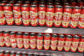 Tuzlanski pilsner is displayed on a shelf in a supermarket