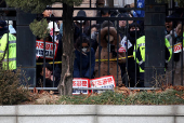 Pro-Yoon protesters participate in a rally outside a court, in Seoul