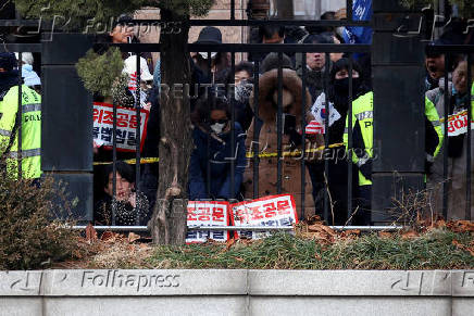 Pro-Yoon protesters participate in a rally outside a court, in Seoul