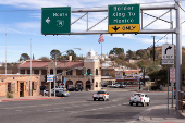 A sign directs drivers to the U.S.-Mexico border in Nogales