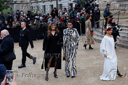 Guests arrive at Schiaparelli Haute Couture Spring/Summer 2025 show in Paris